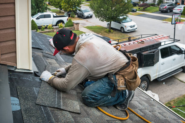 Professional Roof Replacement technician working in Keego Harbor, MI